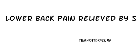 lower back pain relieved by sitting down