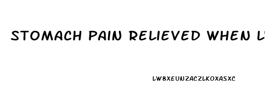 stomach pain relieved when lying down